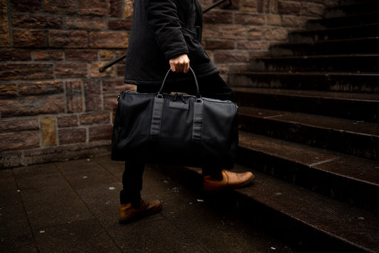 El Doler Black duffel bag styled with model on the Copenhagen central station