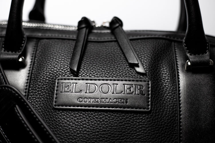 El Doler Black Duffel bag close up photo to logo